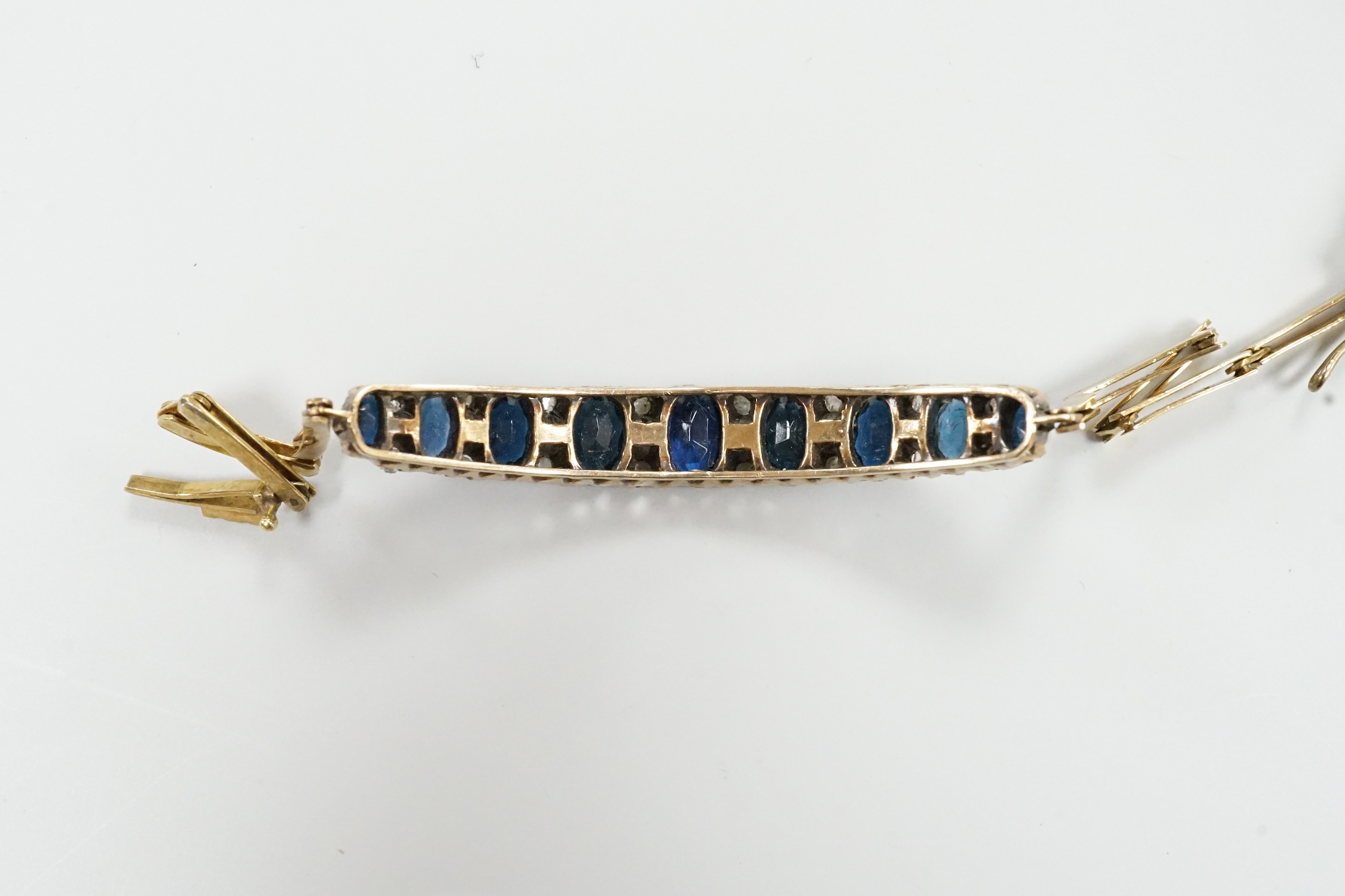 An Edwardian yellow metal, sapphire and rose cut diamond chip set bracelet, approx. 15cm, gross weight 8 grams.